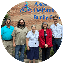 5 people standing in front of Depaul family health center