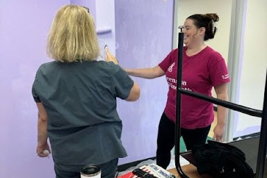 Women painting a wall