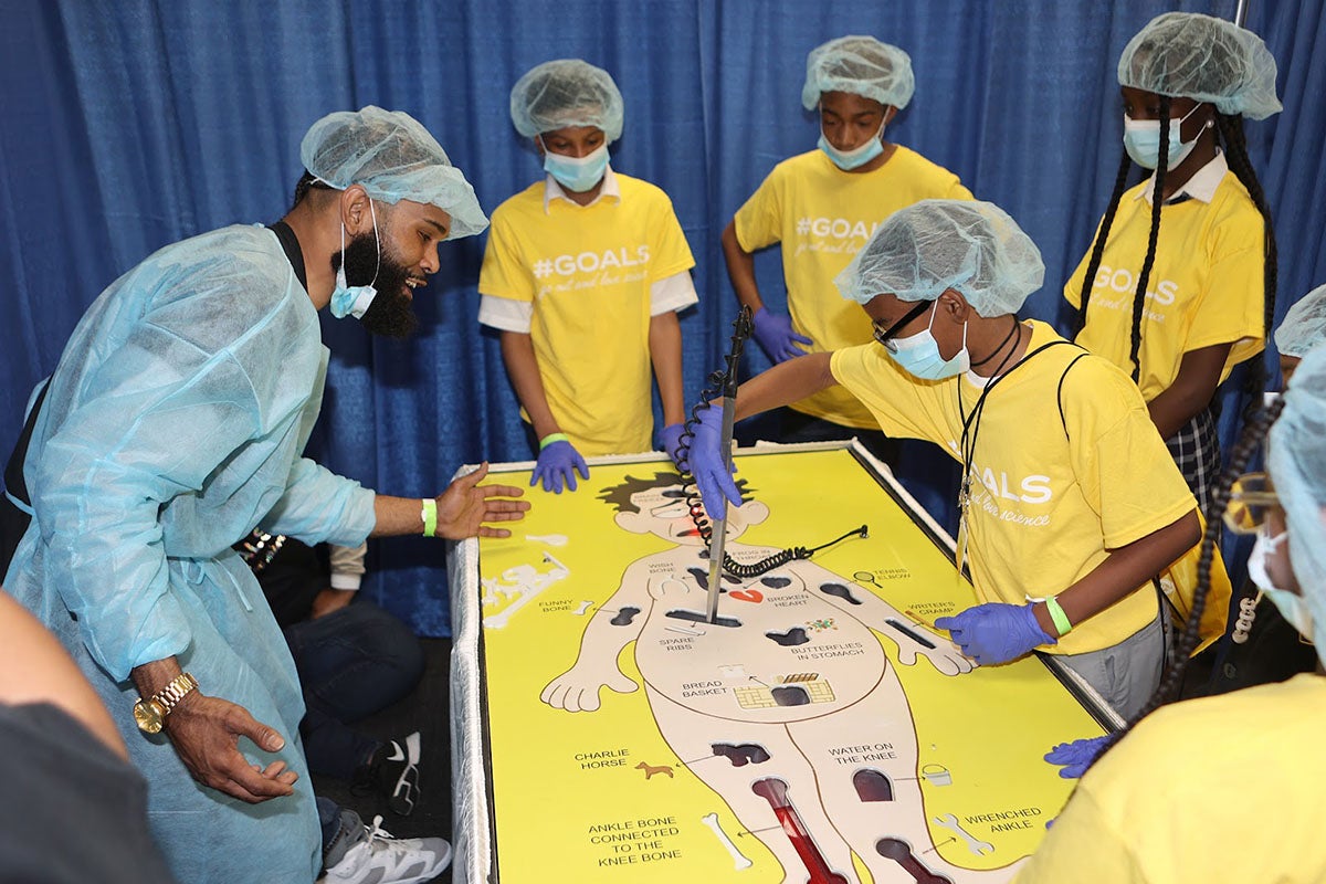 Students learning by playing the game "Operation"