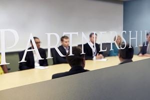Looking into a full corporate meeting room