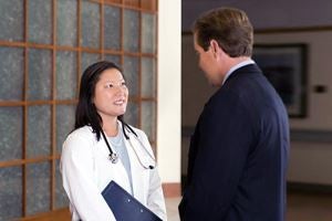 Doctor and business man talking